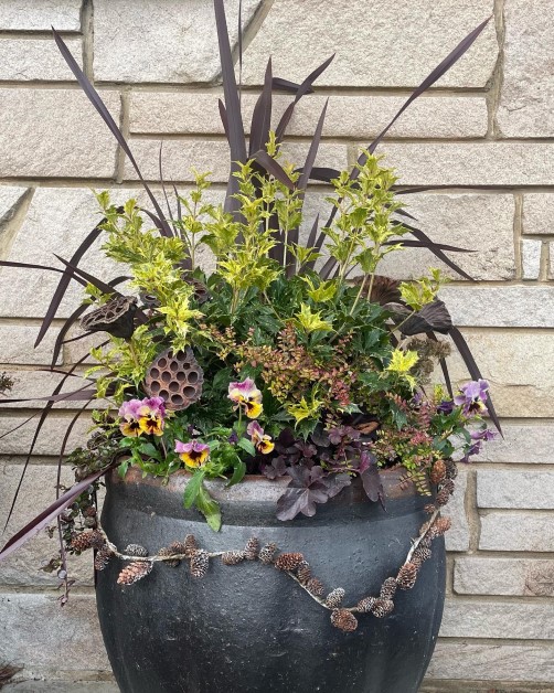 Winter Container Garden blended with Faux Lotus Pods and Snow Accented Pinecone Garland